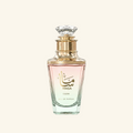 Masa Glow Eau de Parfum bottle with a faceted clear glass body, gold collar, and pink liquid inside, set against a solid off-white background.